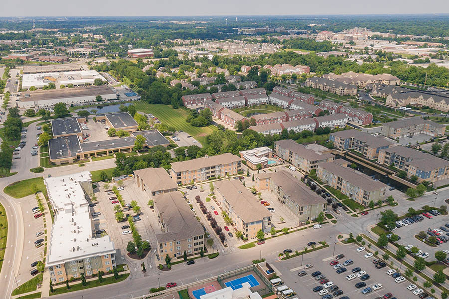 Aerial view of One One Six apartments with skyline in the distance.