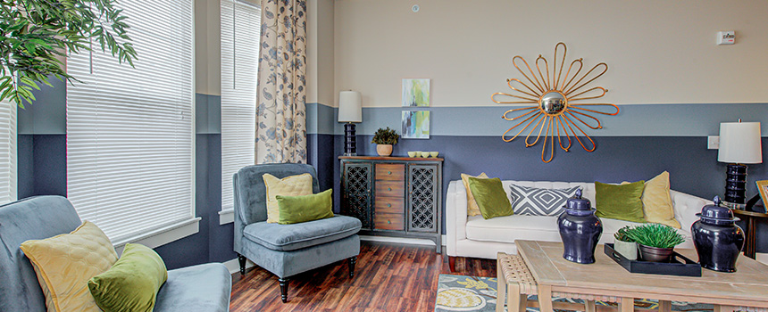 Large living room decorated with blue and green colors in Union Street Flats Apartments